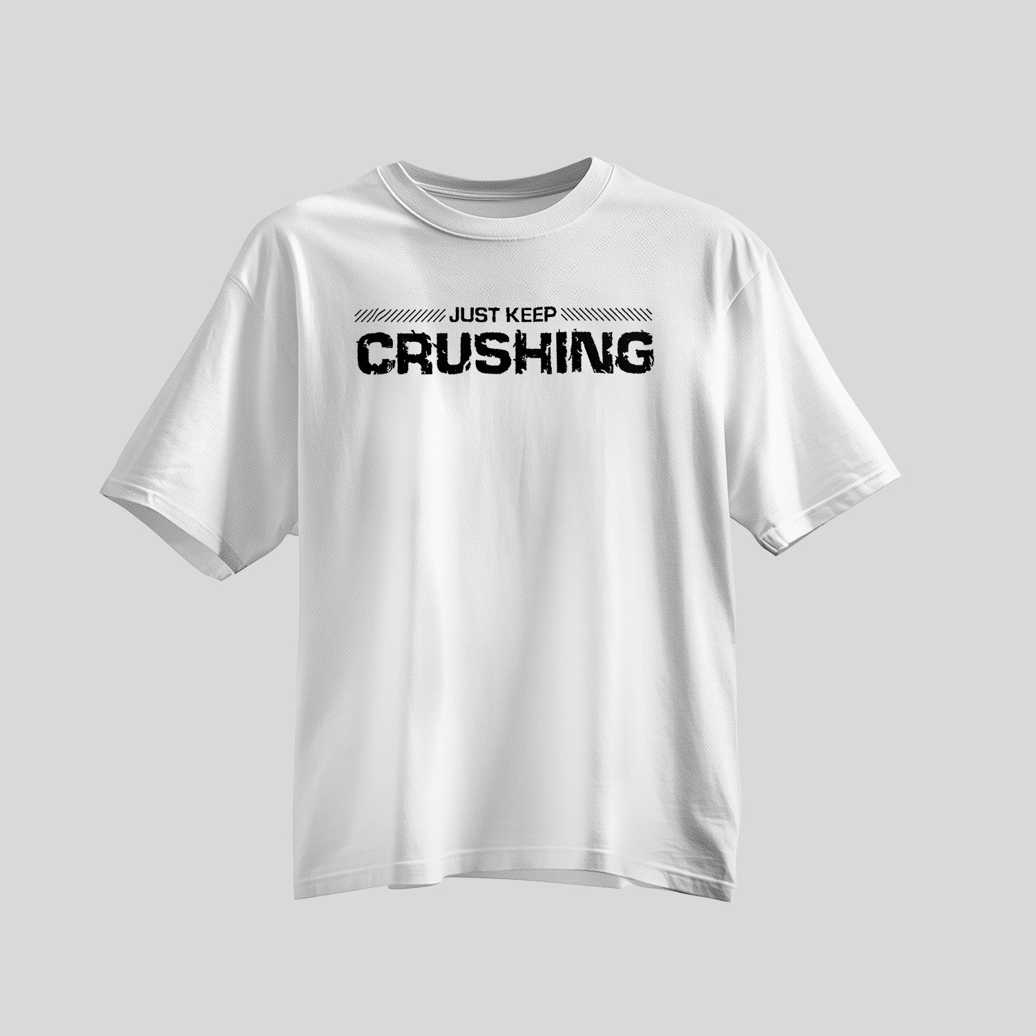 White shirt with bold black font saying Just Keep Crushing across chest