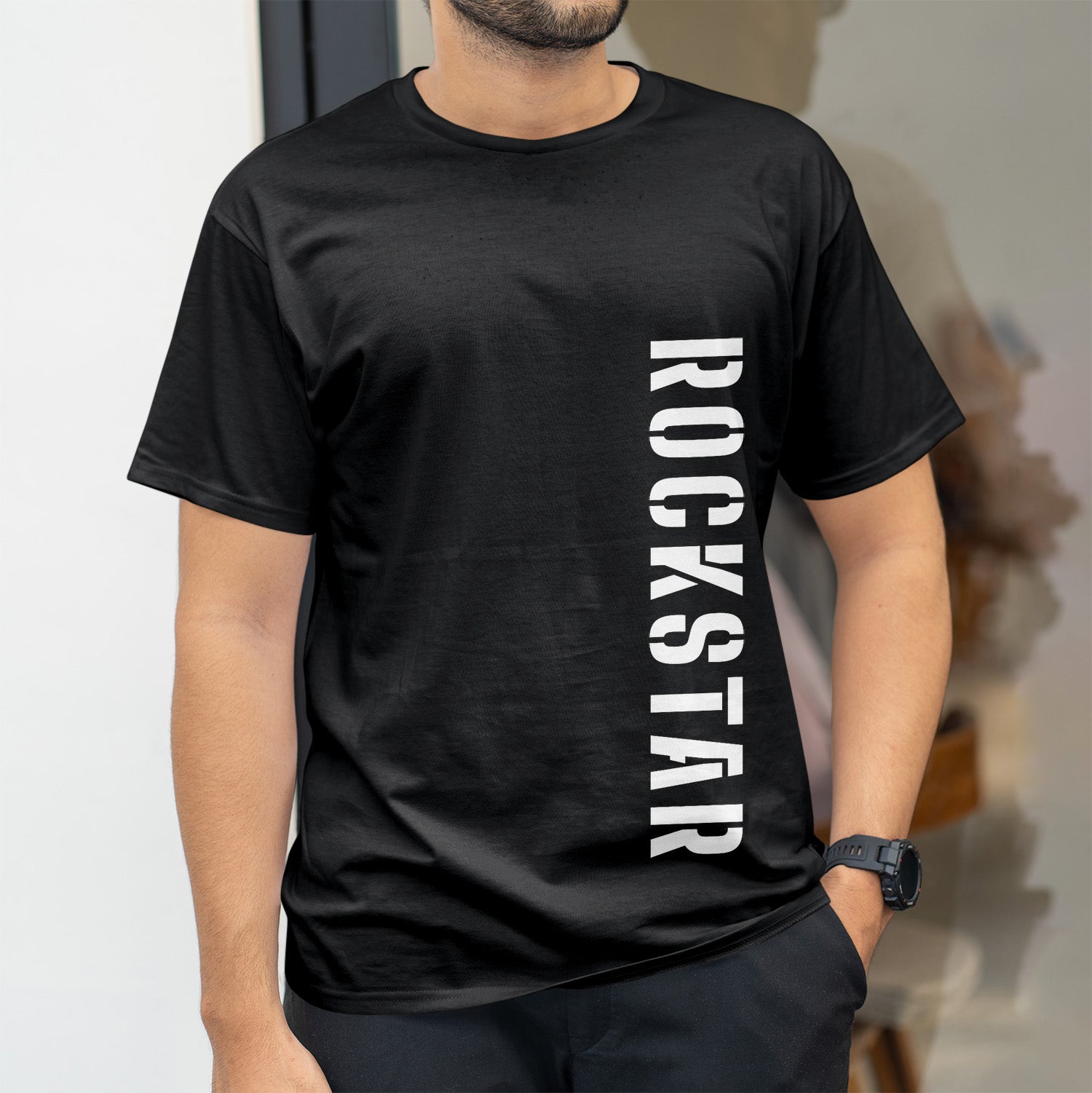 Rockstar in bold font down the left side of black shirt