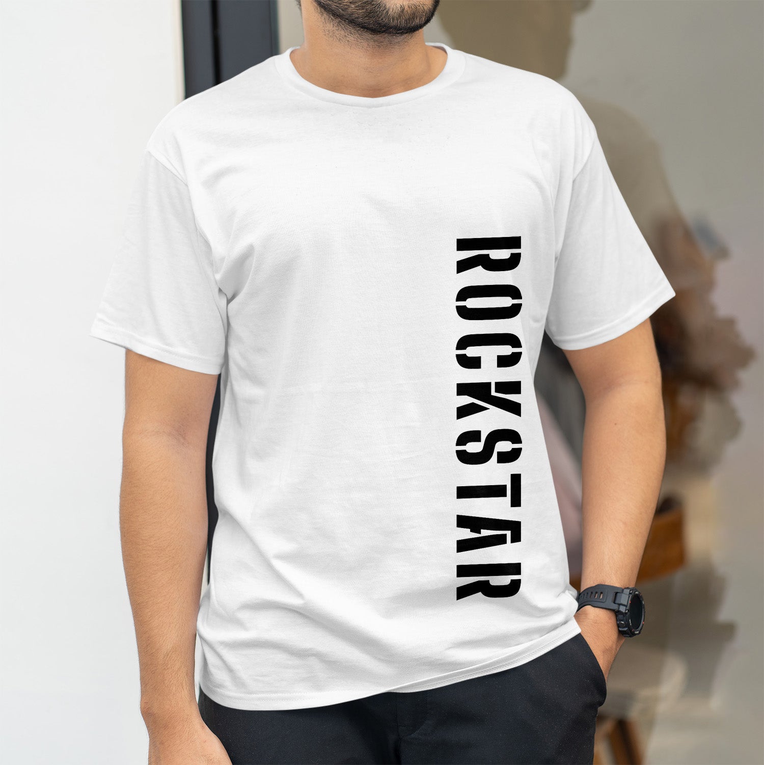 Rockstar in black bold font down the left side of white shirt